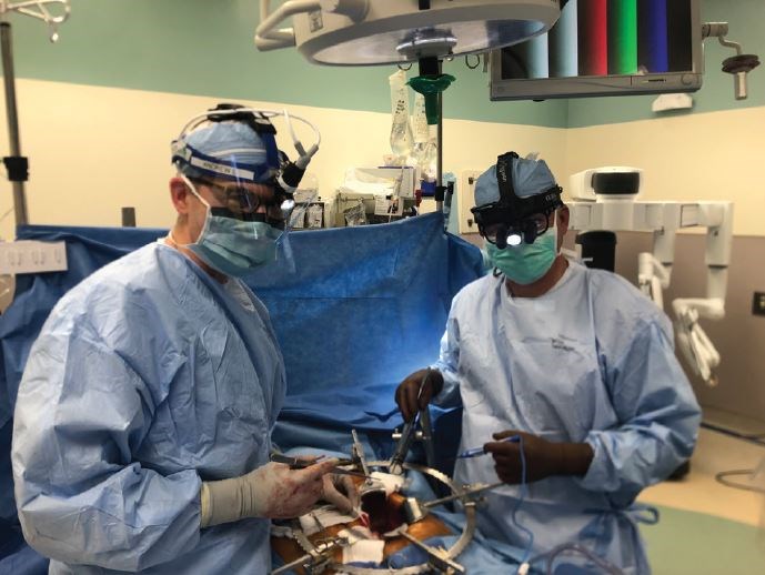 Drs. William, Jr. (left), and William Chapman in the OR