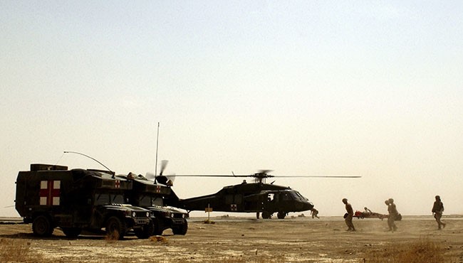 Service members from the U.S. Army 86th Combat Support Hospital at a forward-deployed location during Operation Iraqi Freedom. <br>Photo courtesy National Archives #6644699.