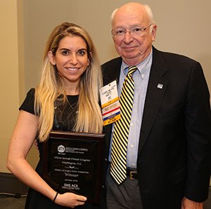 Jessica Buicko, MD, accepting the Winner award from Patrick O'Leary, MD, FACS, Executive Committee, ACS Surgical History Group