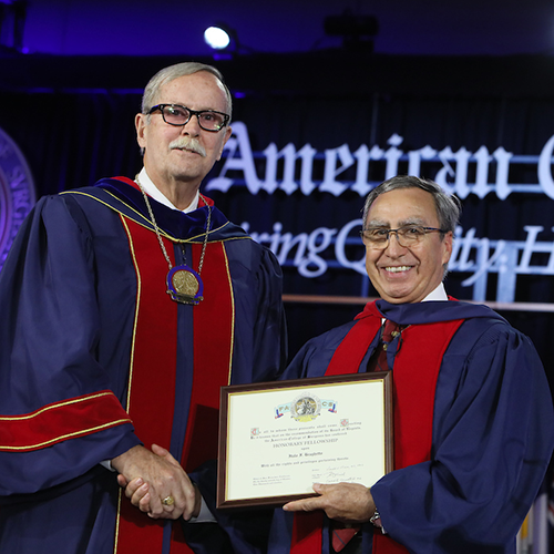 Dr. Ronald V. Maier (left) presents Prof. Italo Braghetto with Honorary Fellowship in the ACS.