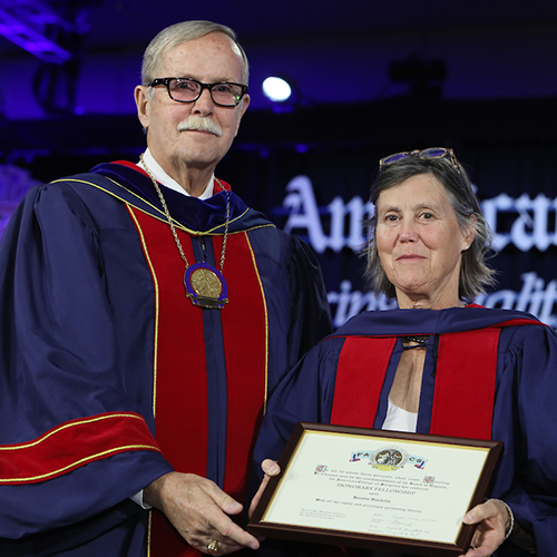 Dr. Ronald V. Maier (left) presents Prof. Kerstin Sandelin with Honorary Fellowship in the ACS.