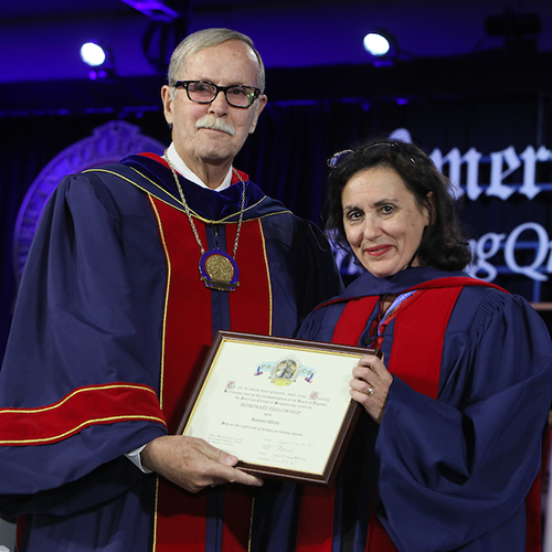 Dr. Ronald V. Maier (left) presents Prof. Laurence Chiché with Honorary Fellowship in the ACS.