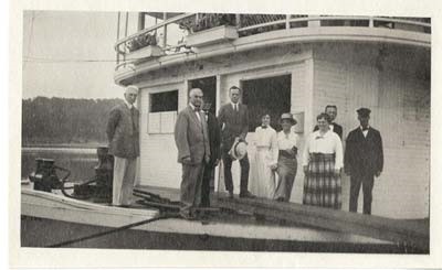 Onboard the SS Minnesota on the Mississippi River (about 1916?) Franklin H. Martin (far left), William J. Mayo (next right), Isabelle H. Martin (wearing a hat). Mayo and his wife Hattie bought the steamship in 1916 and had it until 1922.