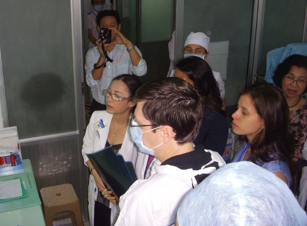 Dr. Senior (middle, wearing mask) teaching in clinic at National ENT Hospital in Hanoi