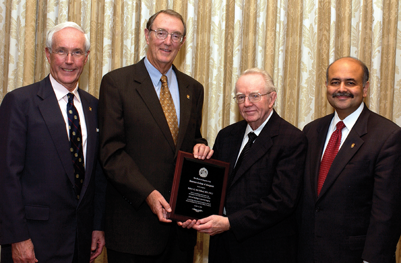 Clinical Congress 2005: The College honors Dr. McClelland’s efforts in spearheading SRGS. From left: Dr. Russell; Edward M. Copeland III, MD, FACS, then ACS President-Elect; Dr. McClelland; and Dr. Sachdeva.