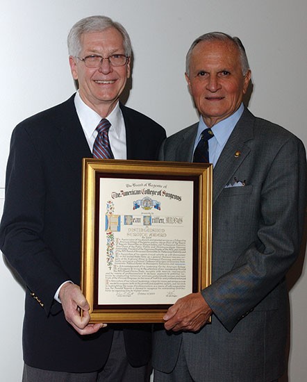 F. Dean Griffen, MD, FACS (left), receiving the Distinguished Service Award during the College’s 2009 Clinical Congress in Chicago, IL, from then ACS President Lamar S. McGinnis, MD, FACS