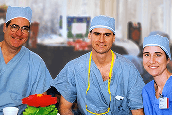 Dr. David P. Winchester (left) with surgical team members, son David J. Winchester, MD, FACS, and  daughter Diane Chisman, RN, MSN