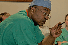 Dr. L.D. Britt mentoring to surgical residents. Courtesy of Eastern Virginia Medical School