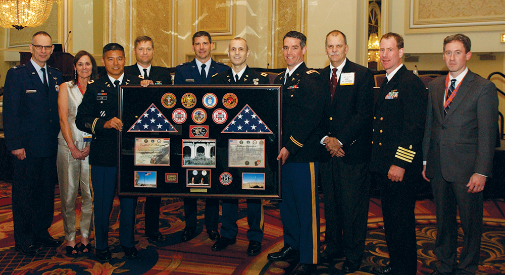Excelsior Surgical Society Scientific Session, Clinical Congress, Chicago, IL, from left: Colonel Jeffrey Bailey, MD, FACS, USAF; Dr. Knudson; Colonel Robert Lim, MD, FACS, USA; Captain Gordon Wisbach, MD, FACS, USN; Colonel Jeffrey McNeil, MD, FACS; Colonel Matthew Martin, MD, FACS, USA; Lieutenant Colonel Steve Satterly, MD, FACS, USA; Dr. Hoyt; Dr. Elster; and Garrett Kirk, MPH, Program Adminstrator, MHSSPACS