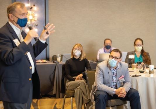 Leonard J. Weireter, Jr., MD, FACS (standing), discusses trauma leadership with Mentoring Day participants