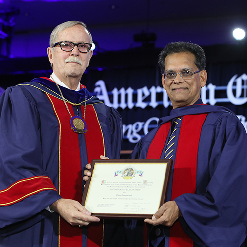 Dr. Ronald V. Maier (left) presents Prof. Vijay Naraynsingh with Honorary Fellowship in the ACS.