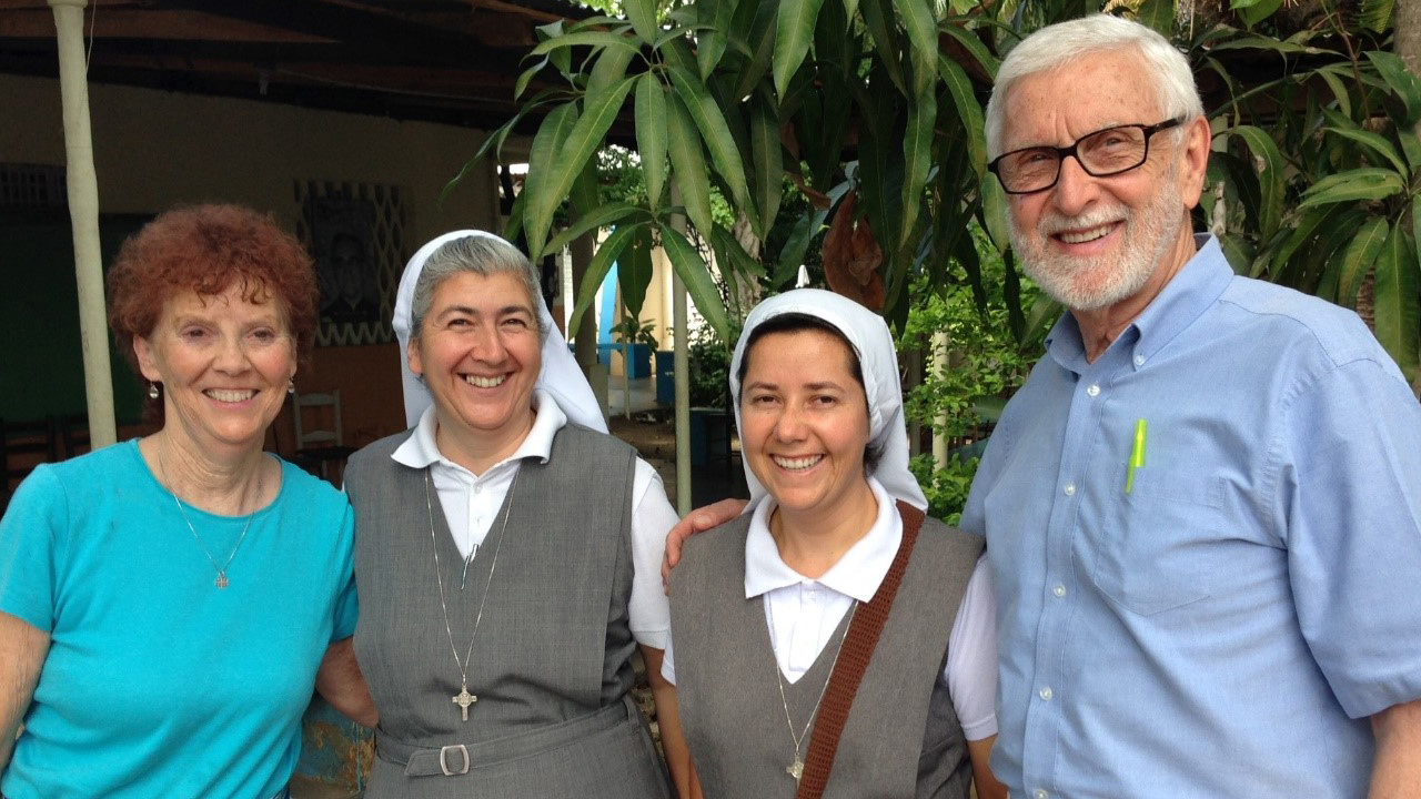 Dr. Charles Filipi (far right) and wife Frances Ann (far left) in Ouanaminthe, Haiti, check on a food program for street children they initiated with Catholic nuns in 2013. This picture was taken in 2015.  