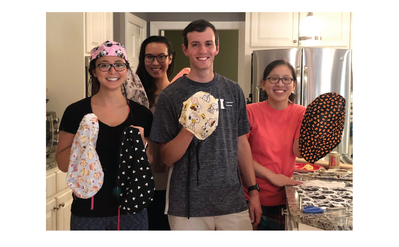 A group of East Carolina surgery residents after an evening of sewing OR hats; from left: Caitlin Takahashi-Pipkin, DO, Tia Sutton, MD, Brandon Peine, MD, and Scarlett Hao, MD.
