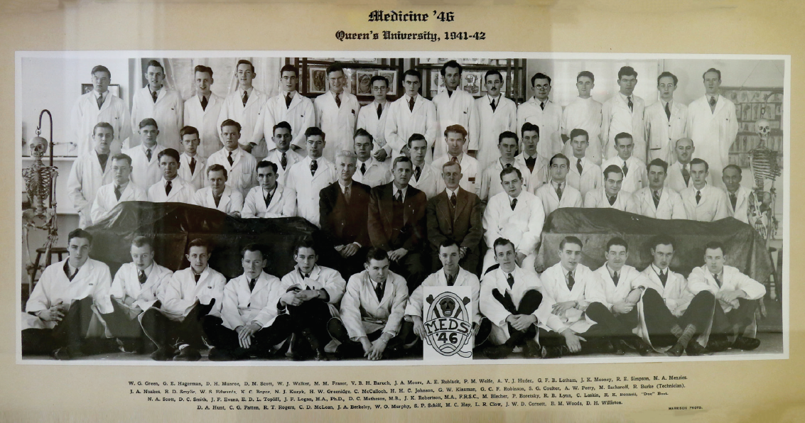 Queen’s University 1946 graduating class: Dr. Schiff is in the front row, holding the sign