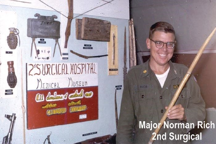 Dr. Rich in Vietnam in 1966, with his collection of wounding devices. The poster states, “donations…gratefully accepted.” This statement was not about collecting money, but rather about collecting wounding devices that injured soldiers would bring in, happy and proud to contribute to the display.
