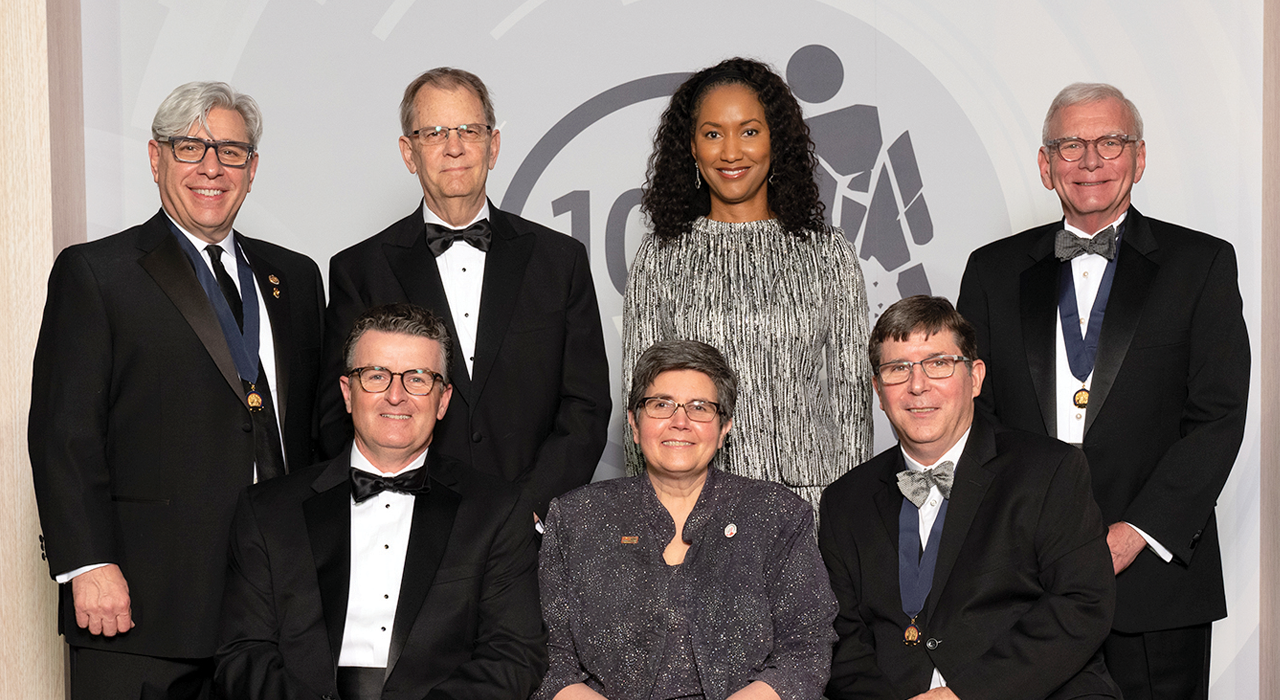 Dr. Turner (standing, second from right) with COT Chairs. Standing, from left: Drs. Michael Rotondo, David Hoyt, and John Fildes. Seated, from left: Drs. Jeffrey Kerby, Eileen Bulger, and Ronald Stewart.