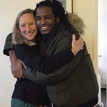 Dr. Dicker (left) with a patient and Wraparound Project client