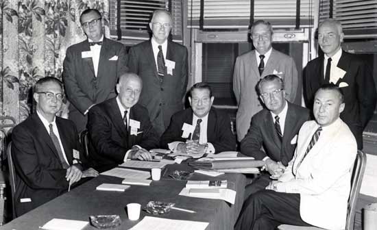 1959 Clinical Congress, Atlantic City, New Jersey, Board of Directors, Franklin H. Martin Memorial Foundation Seated around table left to right: Louis T. Byars, St. Louis; Newell W. Philpott, Montreal; I.S. Ravdin, Philadelphia; James S. Shannon, General Manager SG&O; Joel S. Baker, Seattle  Standing, left to right: Edward G. Sandrok, ACS staff member; Frank B. Berry, Washington; Loyal Davis, Chicago; James T. Priestley <br>(Photo credit: Fred Hess & Son)