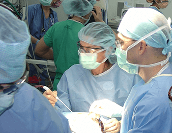 Dr. Knudson (first row, second from left) serves as visiting surgeon treating injured soldiers in Iraq