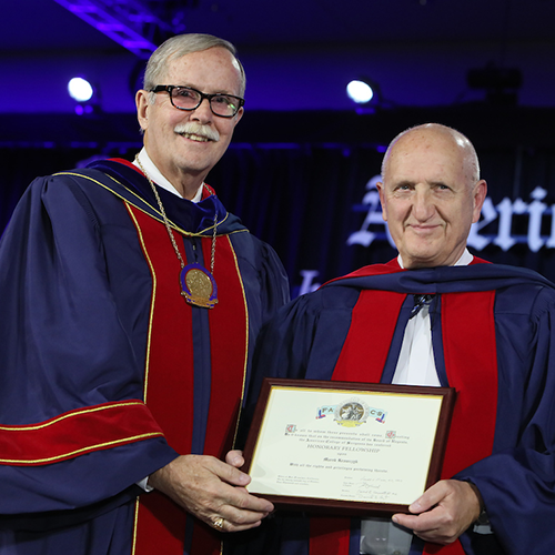 Dr. Ronald V. Maier (left) presents Prof. Marek Krawczyk with Honorary Fellowship in the ACS.