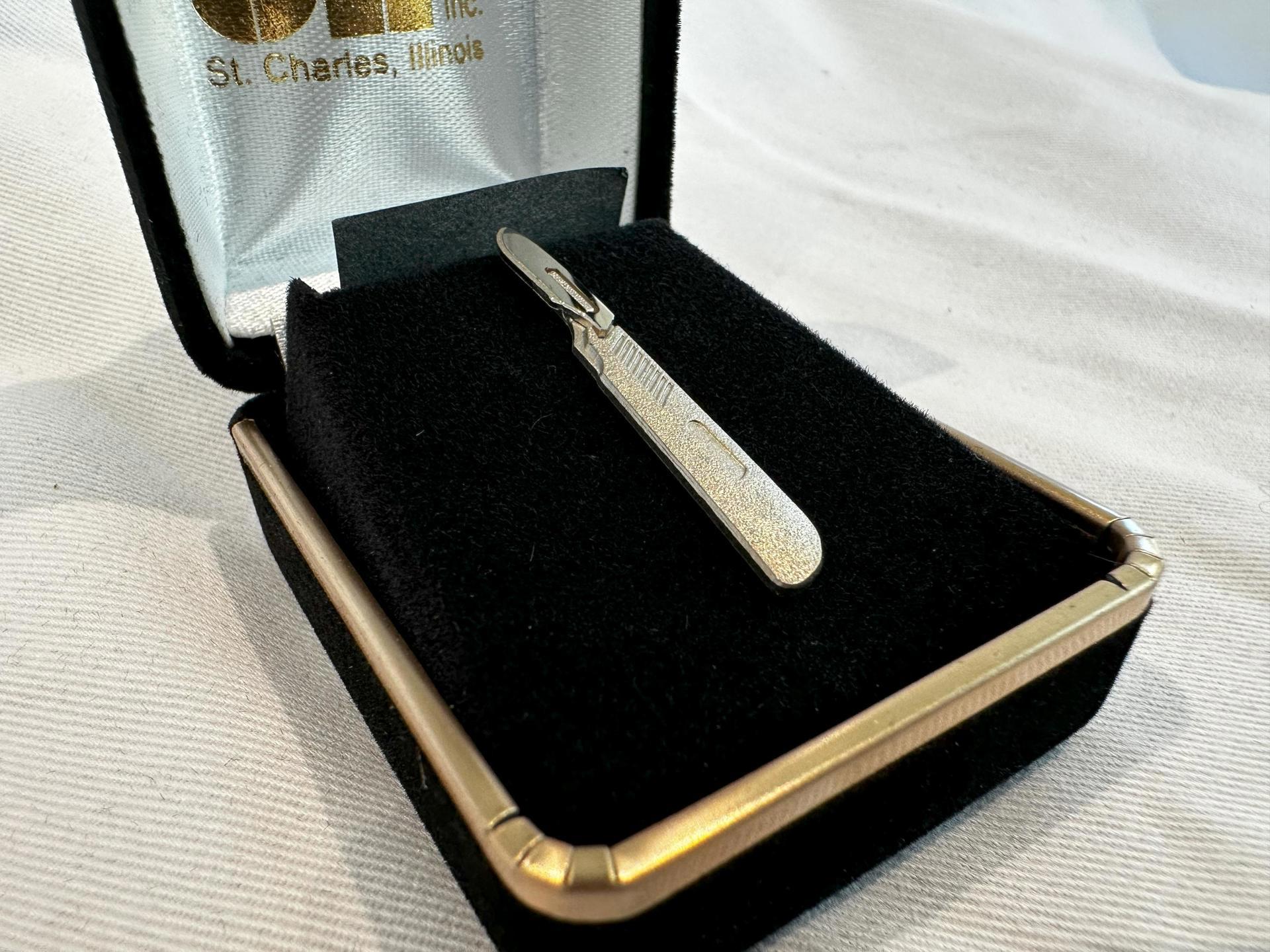 Silver scalpel (Donation of $5,000+)
